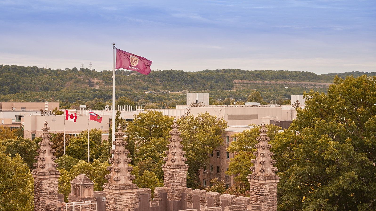 campus photo with mcmaster flag