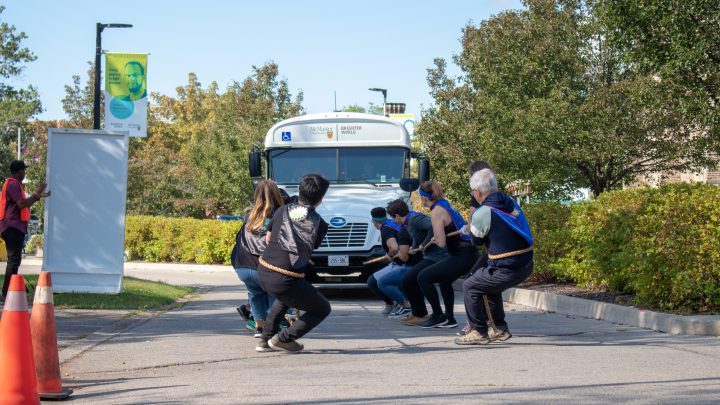 A team pulling a bus