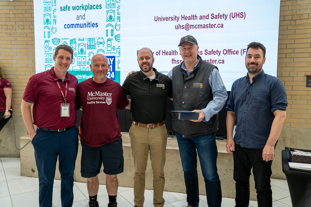 Facilities Service Team accept the Health and Safety Award of Excellence.
